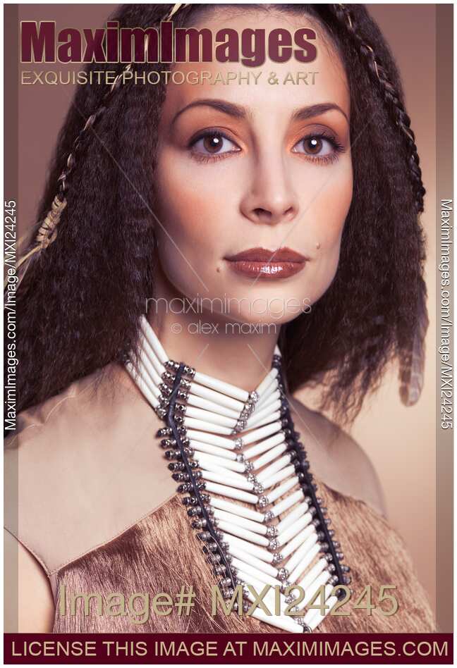 Beauty portrait of a woman wearing aboriginal accessories