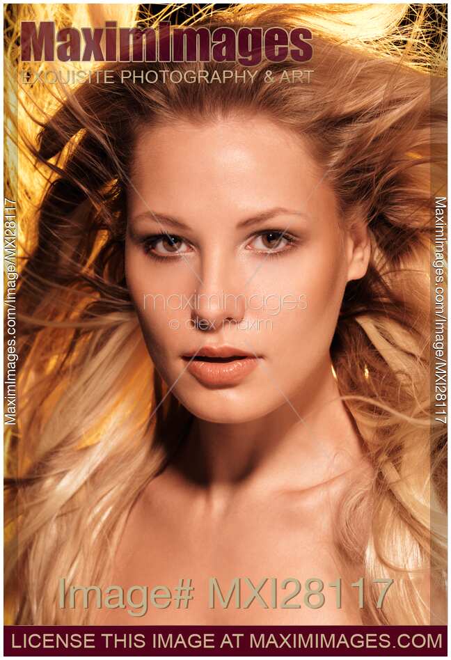 Beauty portrait of a woman with glowing golden blond hair