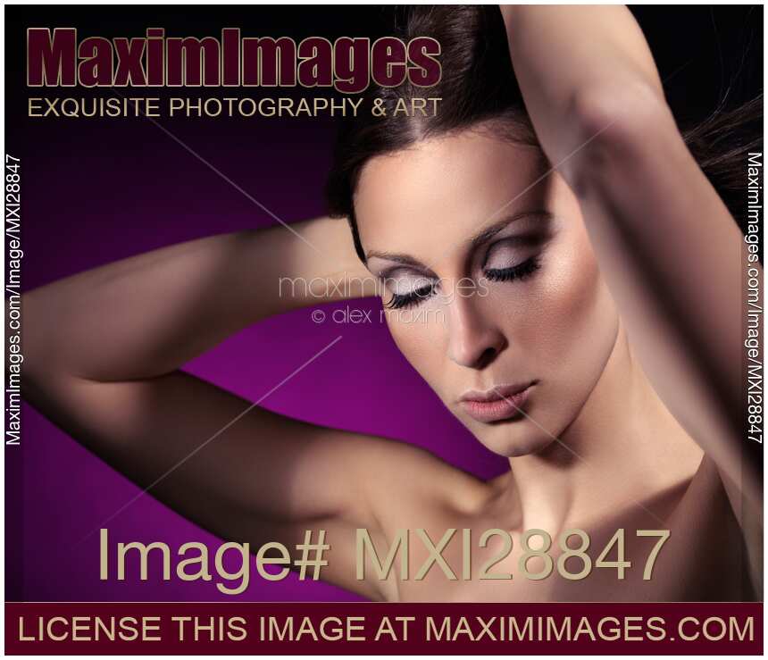 Beauty portrait of a young woman with closed eyes and artistic makeup