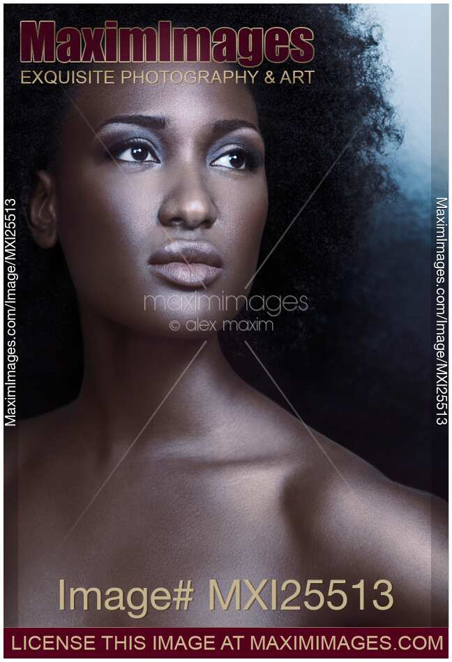 Beauty portrait of black woman with dark shiny metallic skin