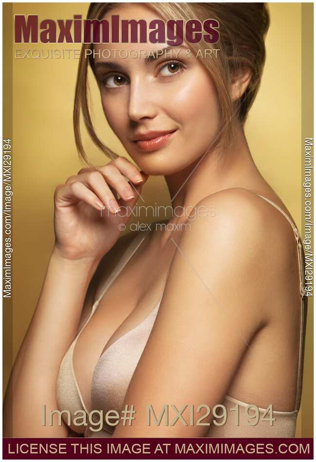 Photo of Beauty portrait of glamorous young smiling woman wearing a bra