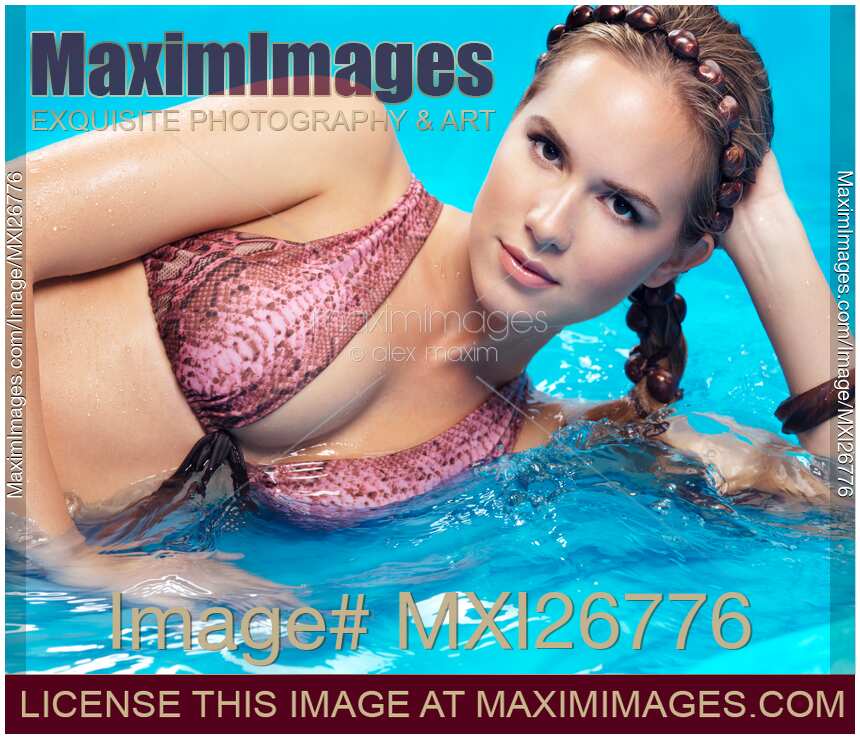 Beauty portrait of woman in bikini in water