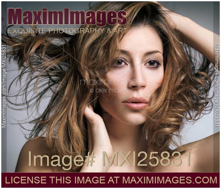 Beauty portrait of woman with flying light brown hair