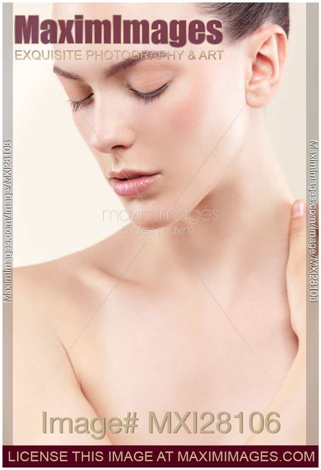 Beauty portrait of young woman face with clean white natural skin closed eyes