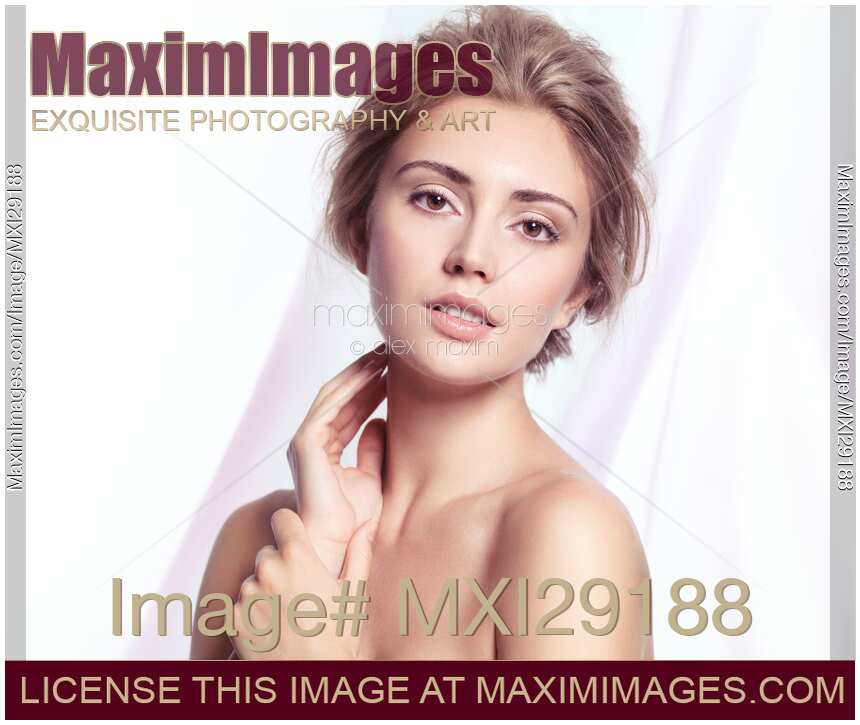 Beauty portrait of young woman with clean natural look and glowing skin