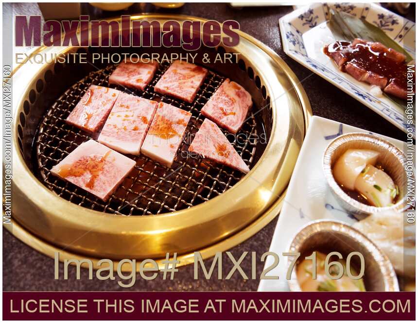 Beef being cooked on grill at Japanese restaurant