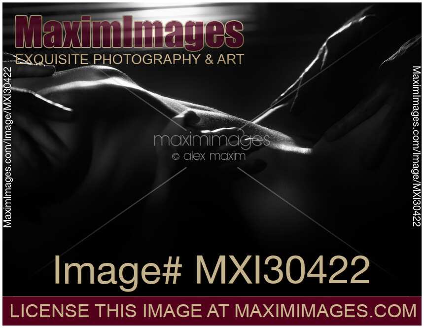 Black and white art nude erotic fantasy of men hands caressing woman body