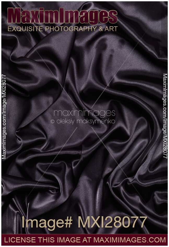 Black shiny silky fabric abstract background