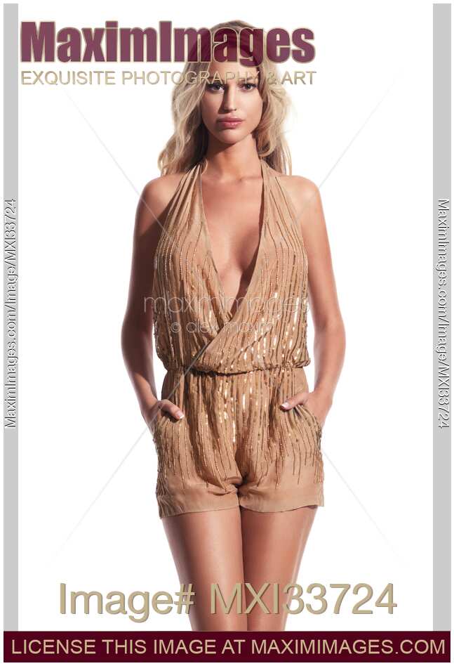 Blond woman wearing gold beige summer beachwear