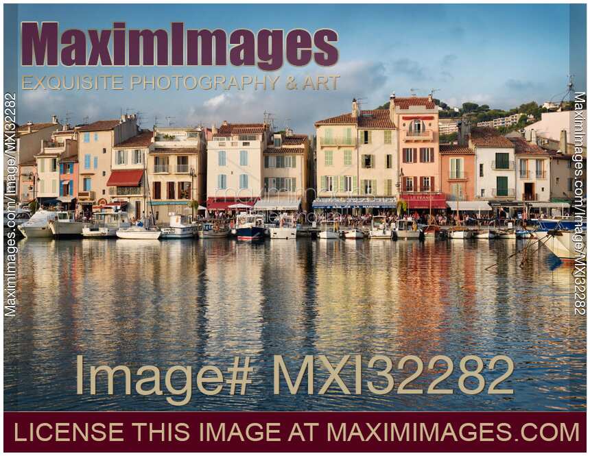 Boats in harbor of Cassis commune quay beautiful French architecture Southern France port town