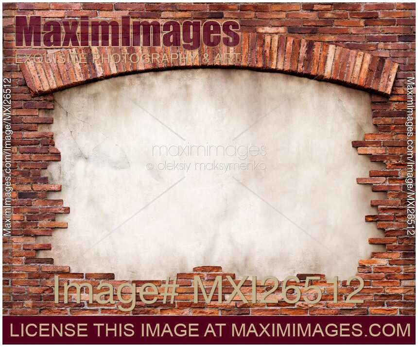 Brick wall with an arch framed background