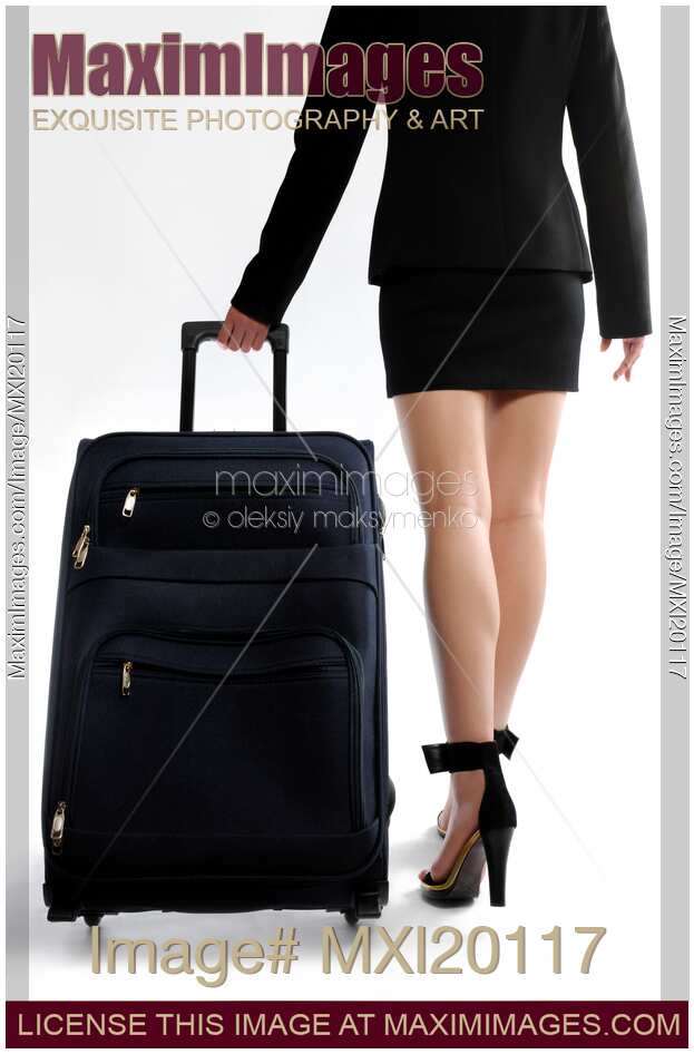 Business woman walking with suitcase