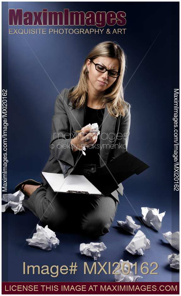 Businesswoman Throwing Crumpled Paper in Outbreak of Anger