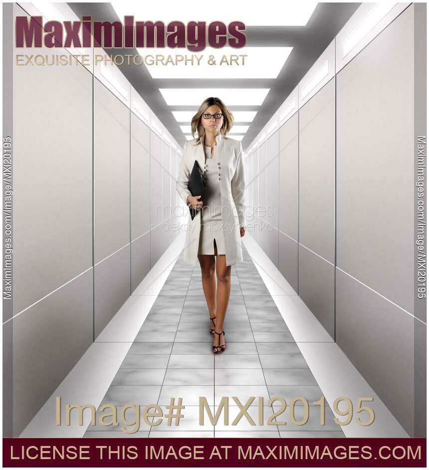 Businesswoman Walking Along a Corridor
