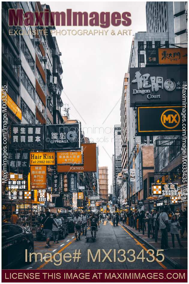Busy streets of Hong Kong China full of people and shop signs