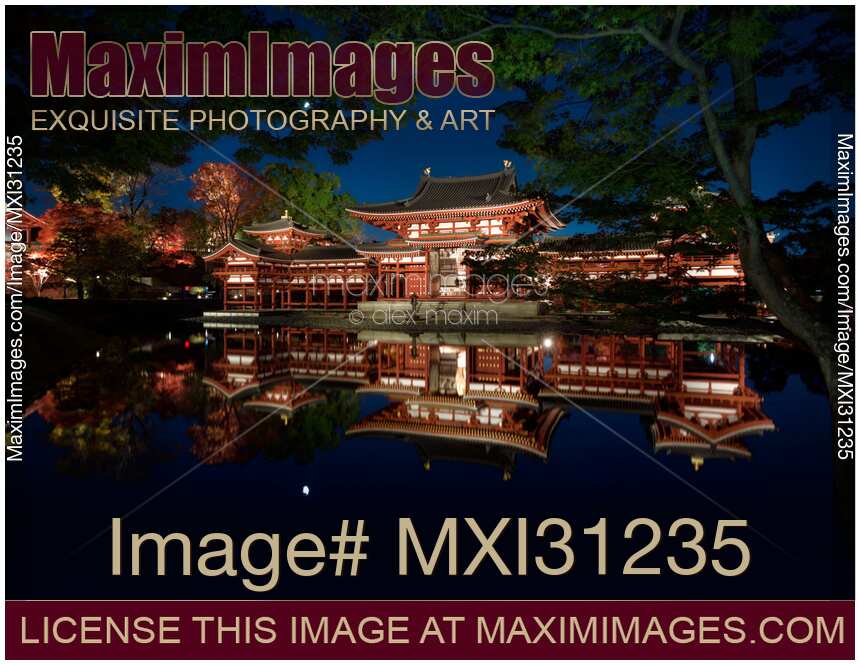 Byodo-in historic Japanese temple Phoenix Hall reflecting in the pond illuminated with lights at night