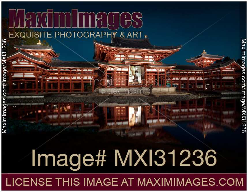 Byodoin temple Phoenix Hall illuminated with lights at night in Kyoto Japan