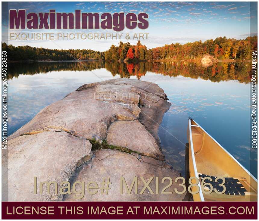 Canoe at a Rocky Shore Autumn Nature Scenery