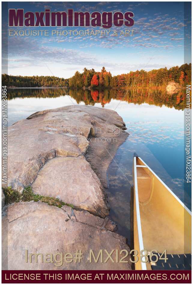 Canoe at a Rocky Shore Autumn Nature Scenery