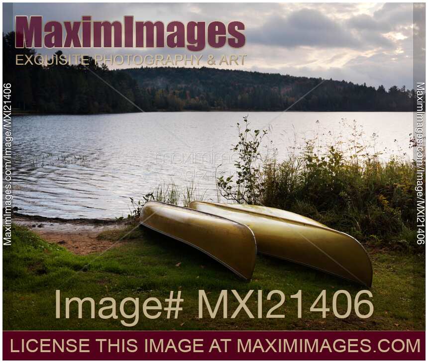 Canoe on a Shore of a Lake at Dawn