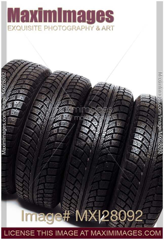 Car snow winter tires on white