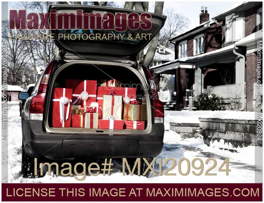 Car with open trunk full of gift boxes Christmas presents