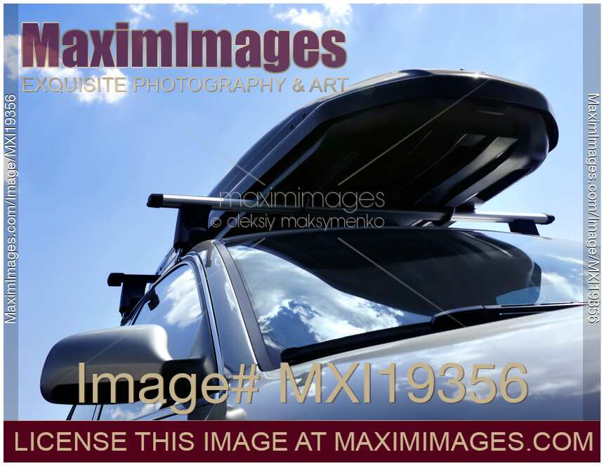 Car with roof rack luggage box