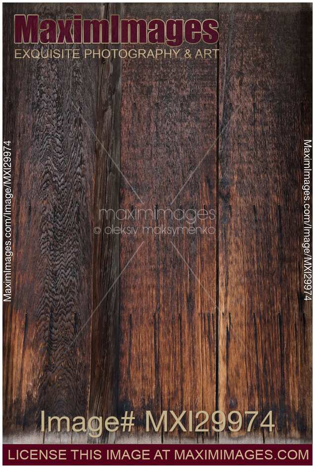 Charred dark wooden boards abstract background texture