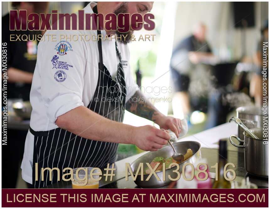 Chef Chris Braun preparing a gourmet competition meal at BC Seafood Festival Chef Challenge