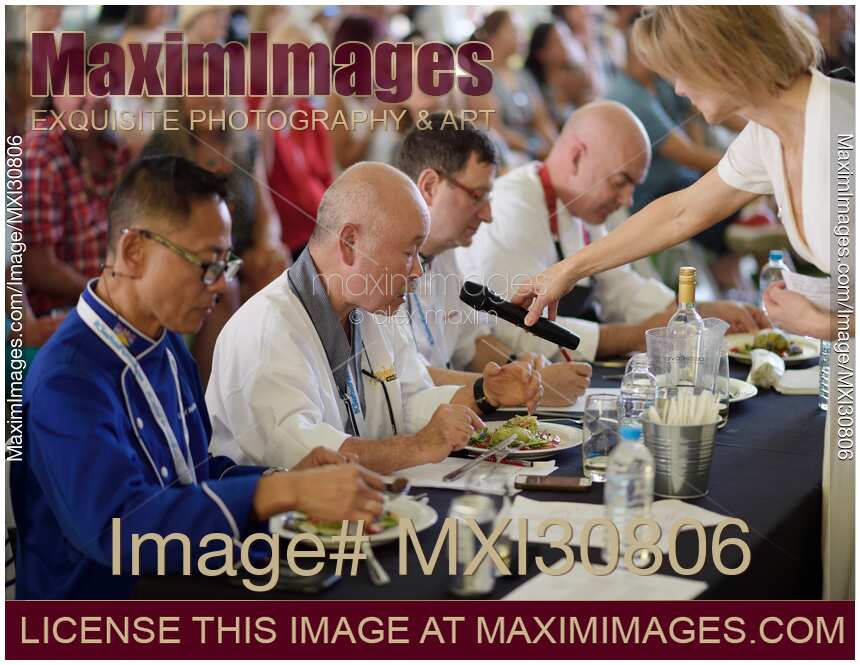 Chefs competition judges commenting on a gourmet meal at BC Seafood Festival