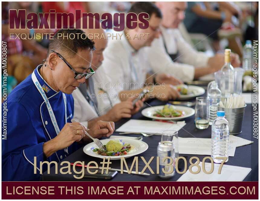 Chefs competition judges evaluating a gourmet meal at BC Seafood Festival in Canada