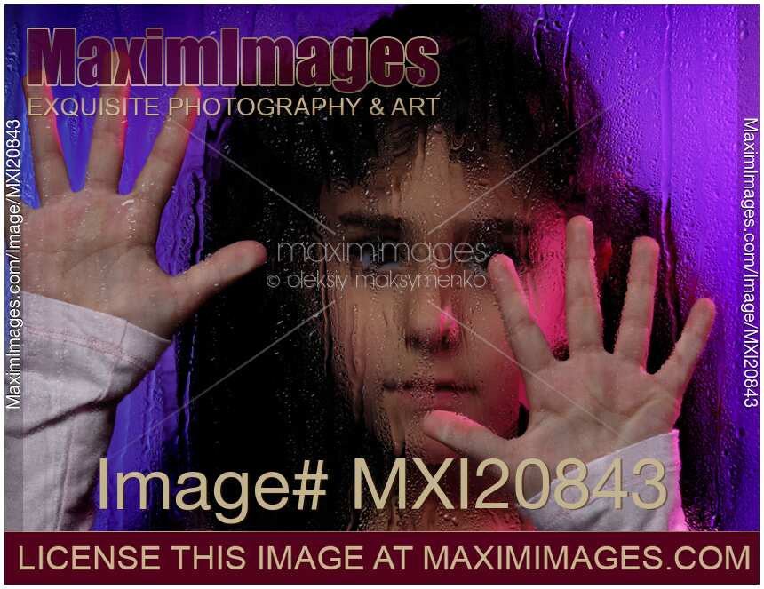 Child Behind Window Pane