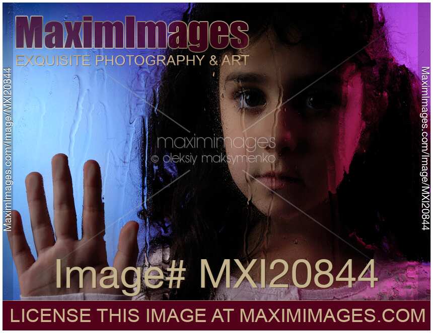 Child Behind Window Pane