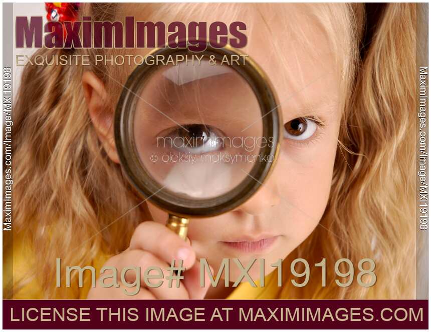 Child Looking Through Magnifying Glass