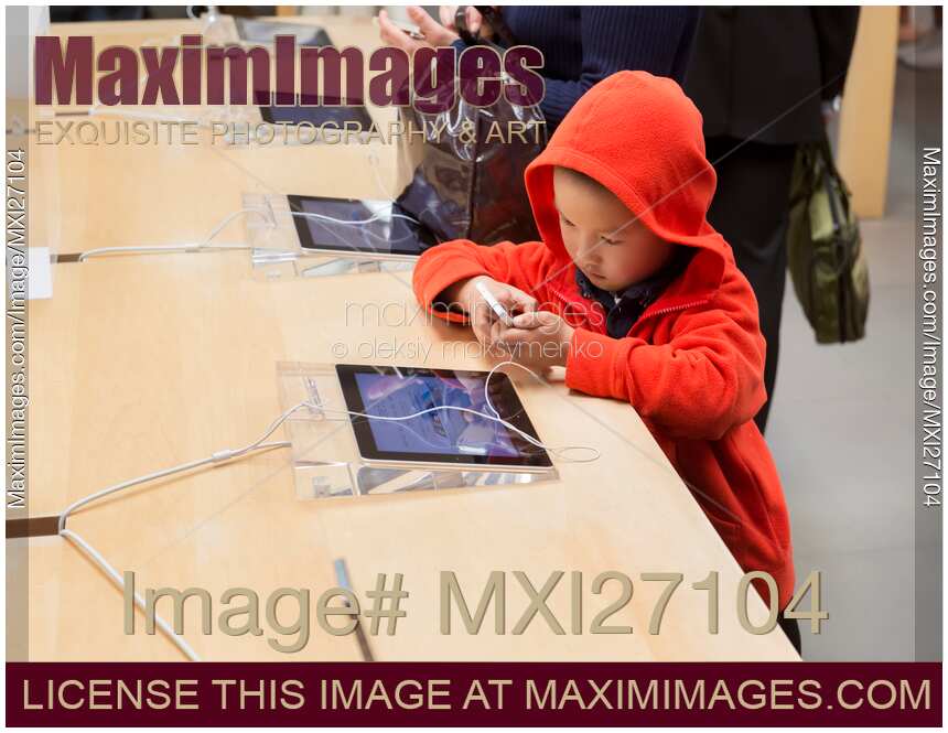 Child using iPhone at Apple store