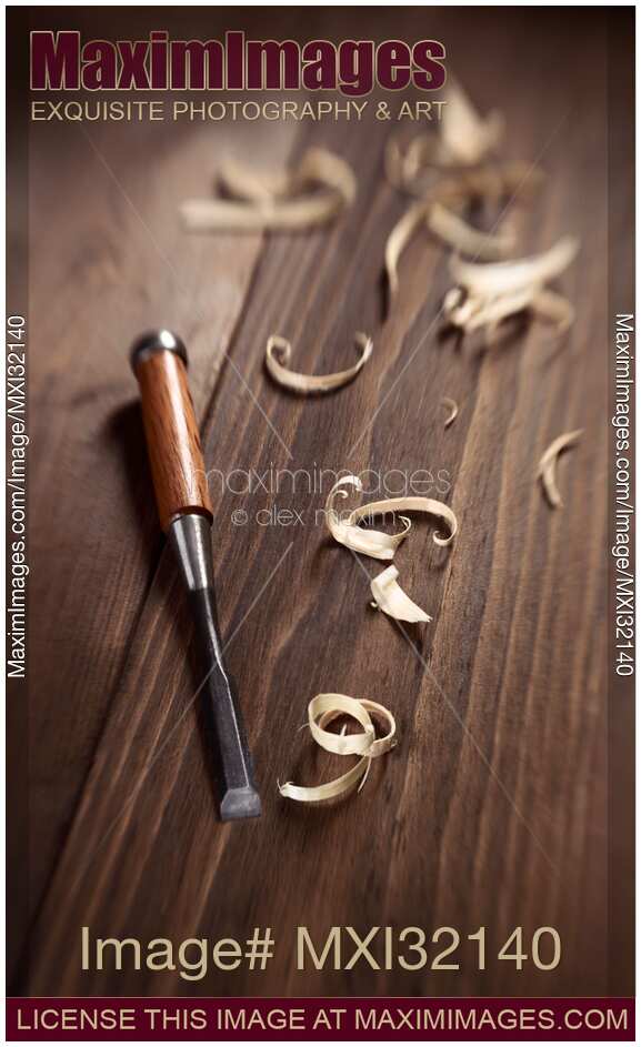 Chisel and wood shavings Carpentry tool still life