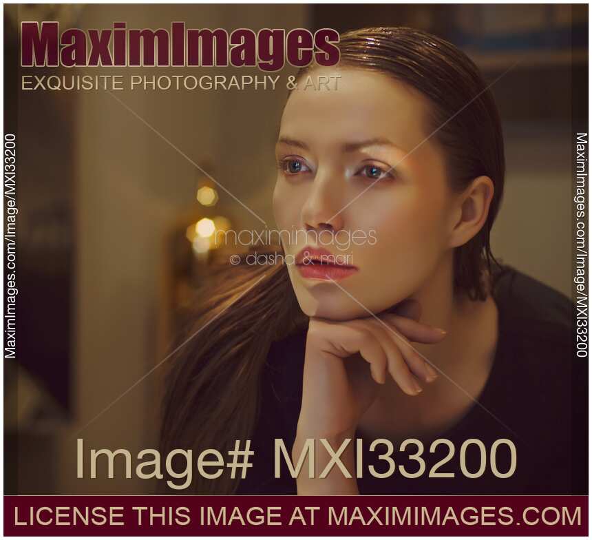 Cinematic style portrait of a beautiful woman face with a pensive look with luxurious high-end styling