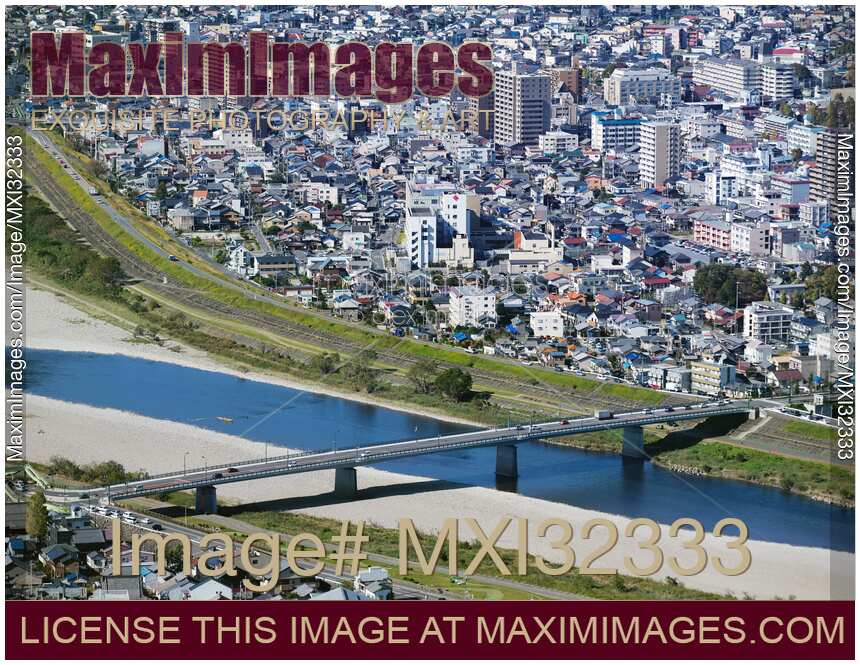 City of Gifu aerial scenery bridge over Nagara River and residential buildings in the background