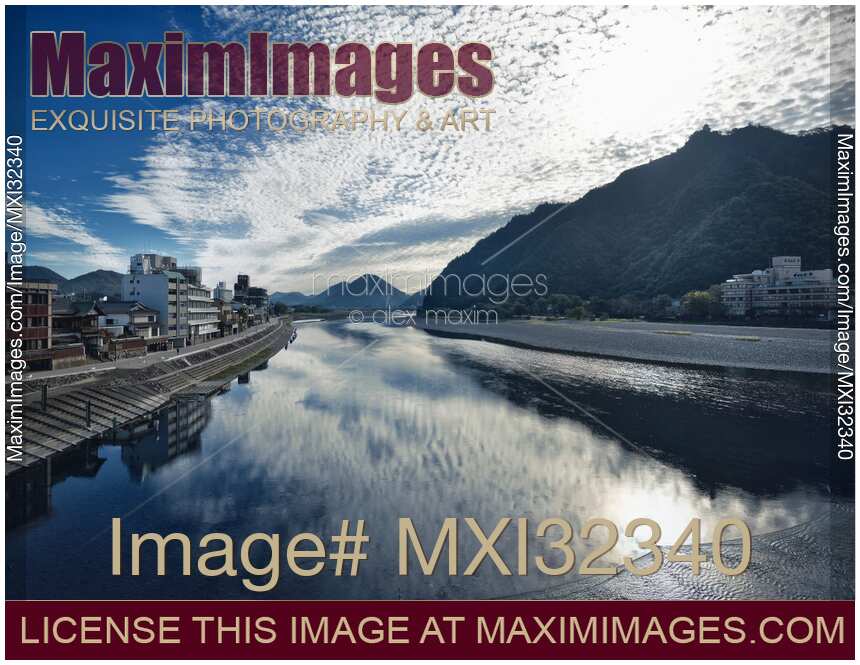 City of Gifu sunrise scenery of buildings along the Nagara River and Gifu Castle on Mount Kinka