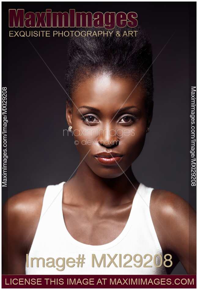 Closeup beauty portrait of a young black african american woman with edgy hairstyle