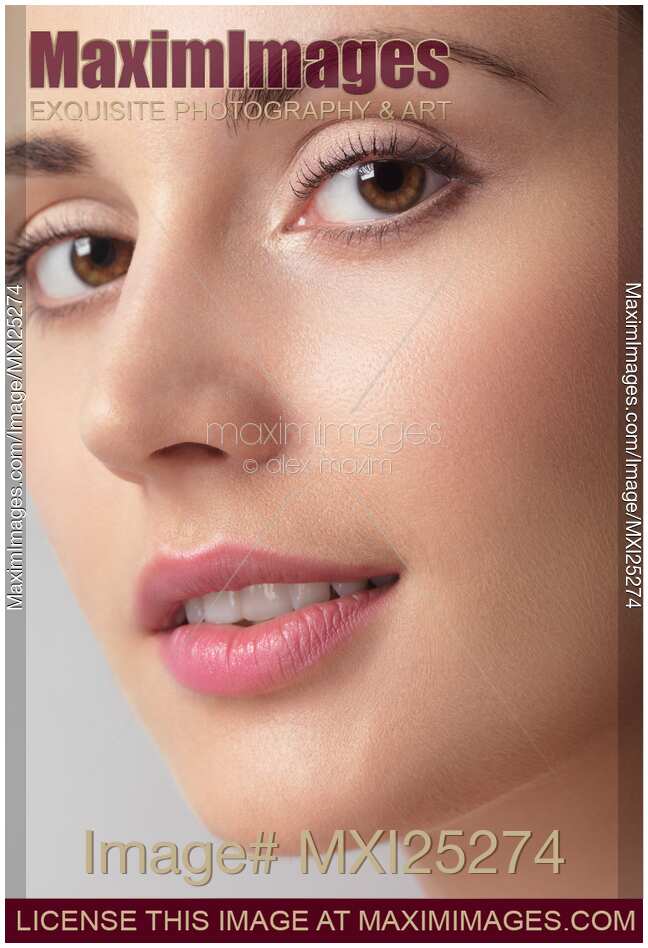 Closeup beauty portrait of young woman face