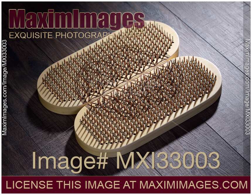 Closeup of a Sadhu Board Yogic board of sharp metal nails