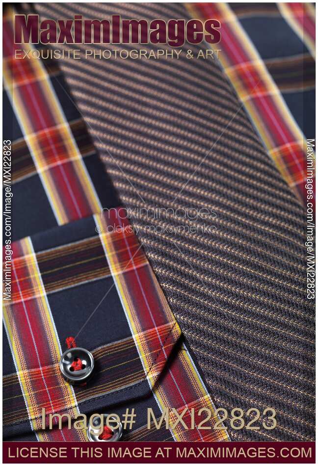 Closeup of a tartan shirt with a necktie