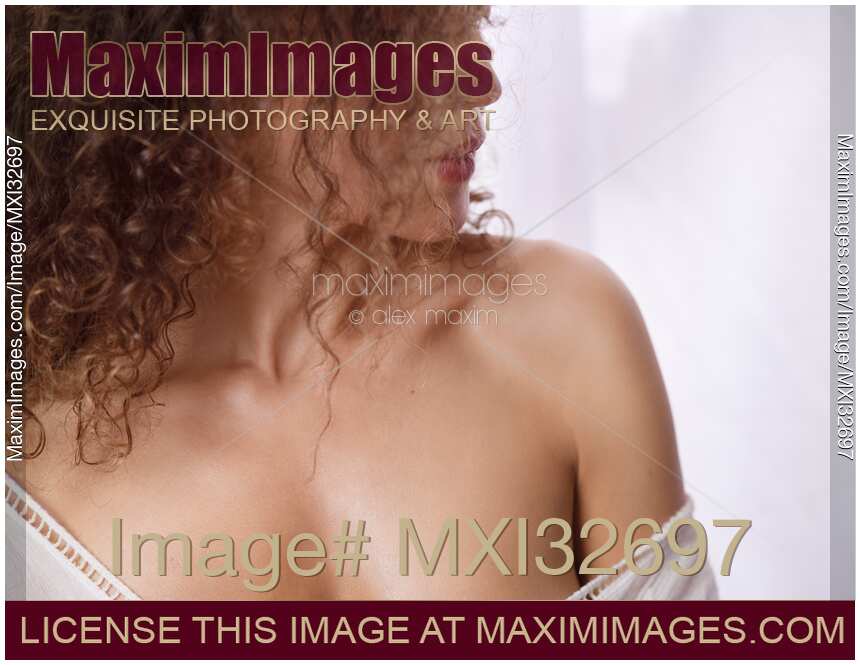 Closeup of a woman bare shoulder with glowing healthy skin Skin care Beauty treatment concept