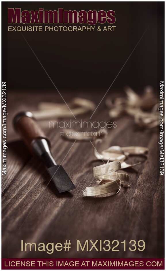 Closeup of Chisel and wood shavings Carpentry still life