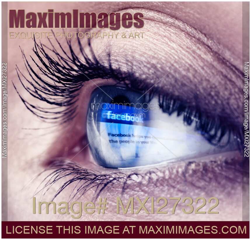 Closeup of eye with Facebook logo reflecting in it