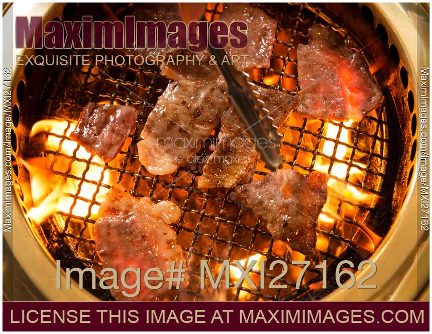 Closeup of Japanese beef being grilled on fire
