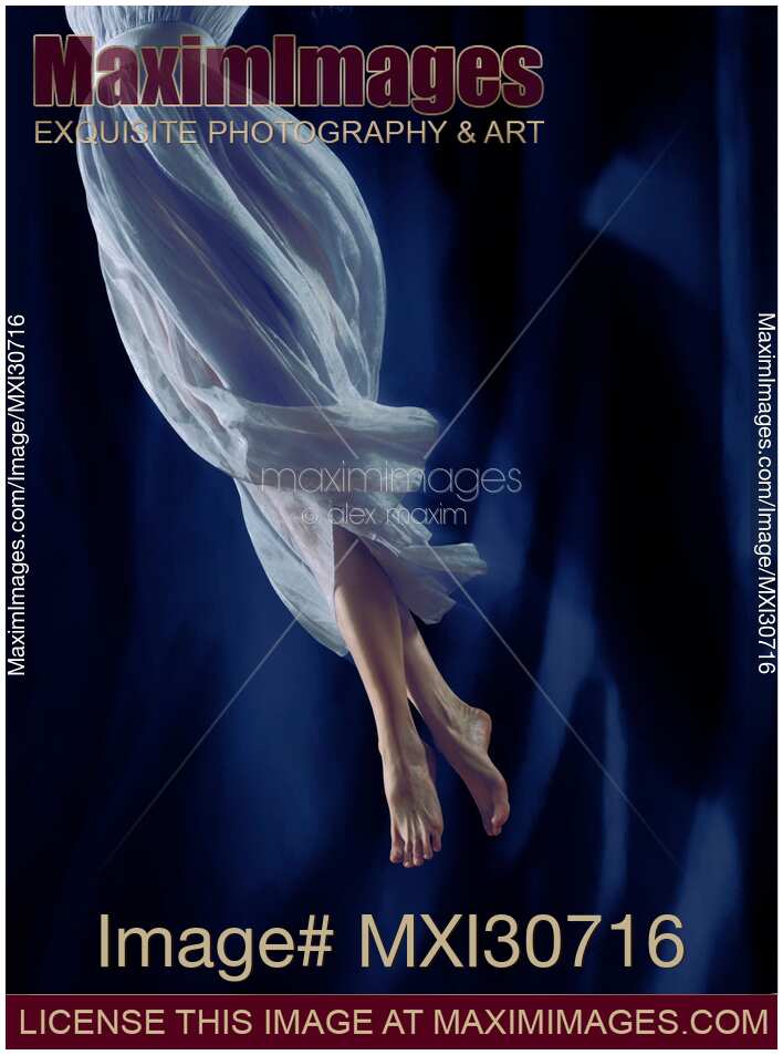 Closeup of legs of a woman dancer spinning in the air
