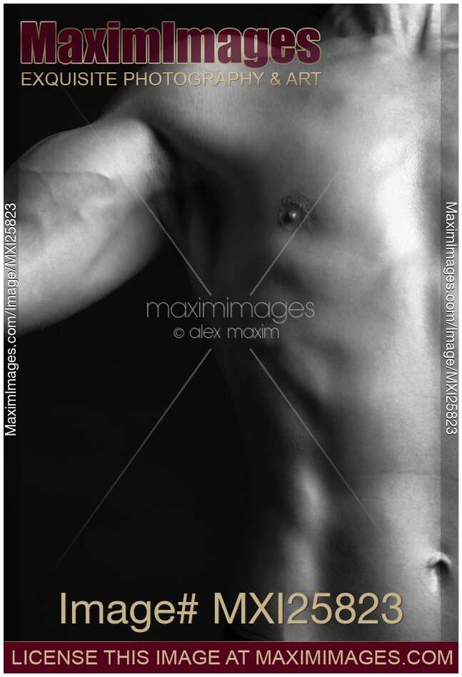 Closeup of man bare fit torso and biceps