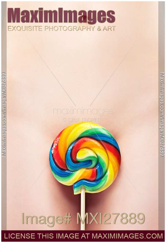 Closeup of Naked Woman Body with a Colorful Lollipop